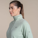 Side profile of woman in mint green Craghoppers fleece pullover with half-zip and high neck.