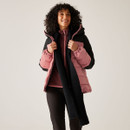 A woman wearing a pink and black padded jacket with a hood.