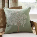 A view of a green Catherine Lansfield tree cushion on a chair