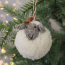 A white felt pom pom sheep decoration.