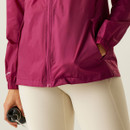 A close up view of the jacket's hem and zip closure.