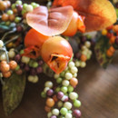 A close up view of a harvest berry autumnal wreath