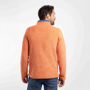 The back of a man wearing an orange fleece with a high neckline.