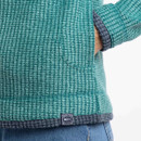 A close up view of one of the fleeces lower side pocket.