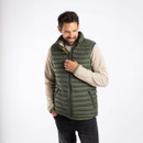 A man wearing a light green padded gilet.