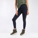 Woman wearing navy-coloured leggings paired with green walking boots and striped socks.
