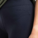 Close-up of navy-coloured leggings featuring a subtle embroidered "WEIRD FISH" logo near the waistband.