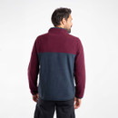 The back of a man wearing a fleece with a navy body and aubergine coloured upper and arms.