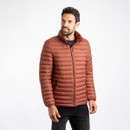 A man wearing a conker brown grey padded jacket.