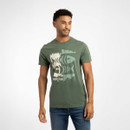 Man wearing a short-sleeve green T-shirt featuring a large abstract double fishbone design and "Weird Fish" text on the front.