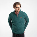 A man wearing a deep teal coloured quarter zip fleece.