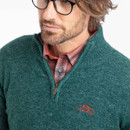 A close up view of the fleeces quarter zip design and red embroidered logo on the chest.