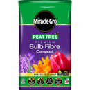 Packaging for Miracle-Gro Peat Free Bulb Fibre Compost. Features vibrant flowers and highlights the product's key benefits: fast root growth, 3-month feed, and 14 nutrients.