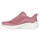 A side view of a pink trainer with a white sole.