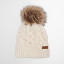 Cosy cream knit beanie with cable pattern, featuring a fluffy brown faux fur pom-pom on top. A branded leather patch adds a touch of elegance.