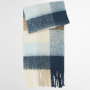 Soft wool scarf in a checkered pattern of blue, beige, and cream hues, with fringed edges. The design conveys warmth and cosiness.