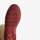 A view of the wellingtons red sole.