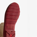 A view of the wellingtons red sole.