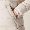 A close up view of one of the jackets lower side pockets.