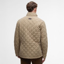 A person is wearing a beige quilted jacket, viewed from the back, with a diamond pattern. The scene is minimalist with a neutral tone.