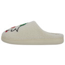 Side view of a cream mule slipper with a cosy sherpa-style texture, cushioned sole, and part of a festive embroidered gnome visible on the upper.