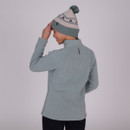 A back view of a woman wearing a sage Shires Aubrion half zip fleece