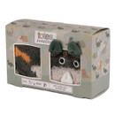 Side view of Totes Toasties Kids Super Soft Slipper-Sox gift box featuring two fun pairs — one with a dinosaur face and 3D ears, the other in a colourful camo print, in dinosaur-themed packaging.