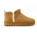 Side view of a tan suede ankle slipper boot with a thick brown rubber sole and distinctive cream zigzag stitching running vertically up the side and around the collar.