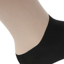 A close up view of sand coloured Shires Aubrion performance socks on a white background