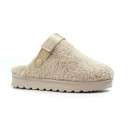 Beige slip-on clog-style slipper with a textured faux-shearling upper, a sturdy ridged rubber sole, and an adjustable gold-toned strap secured by a press stud near the ankle. Designed for indoor comfort and casual wear.