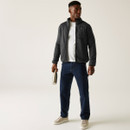 Full body shot of male model wearing Barlee fleece jacket in Black, paired with white tee and navy trousers, holding a stainless steel water bottle.