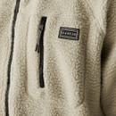 Close-up of the zip chest pocket and "DARE 2B" logo on the Abbey Stone fleece jacket, highlighting material texture and stitching.