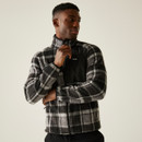 A male model wearing a black and grey check fleece jacket with full zip and high collar, shown mid-zip against a plain beige backdrop. A male model wearing a black and grey check fleece jacket with full zip and high collar, shown mid-zip against a plain beige backdrop.