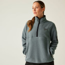 Front view of a woman wearing the Element Grey fleece, showing the half-zip closure, Dare 2B chest logo, and zipped side pockets with relaxed fit.