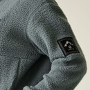 Close-up of the left sleeve on the Element Grey fleece, featuring a black Dare 2B mountain patch logo stitched near the shoulder.