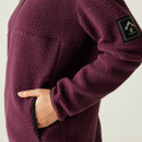 Close-up of the side pocket and sleeve badge featuring a mountain design, highlighting the soft fleece texture.