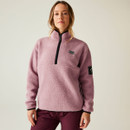 Woman wearing a lilac pink DARE2B fleece with half zip and black contrast trim, standing against a plain background.