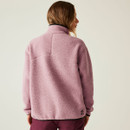 Rear view of woman in lilac pink DARE2B fleece showing the curved yoke seam and branded hem logo.