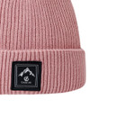 A close up view of the black Dare 2b branding at the front of the beanie hat.