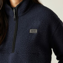Close-up of the left chest area, showing the Dare2b logo patch and the black trim on the fleece’s zipper.
