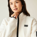 Close-up of the Dare2b fleece collar and half-zip design, showing soft borg texture and logo patch on chest.