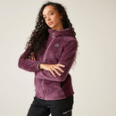 A woman wearing a purple full zip fluffy fleece.