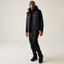 Model wears complete outdoor set with black padded vest, trekking trousers, and hiking boots – Regatta adventure-ready winter look.