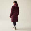 The back of a woman wearing a deep red coloured padded jacket.