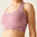 Detailed close-up of the front lower band of the lilas sports bra showing the textured knit and Dare 2b logo.
