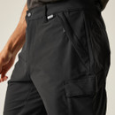 Close-up of front pocket detail on black Regatta Questra cargo trousers, highlighting zip and branded label.