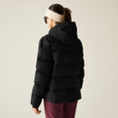 The back of a woman wearing a short black padded jacket.