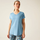 A woman wearing a light blue v-neck t-shirt.