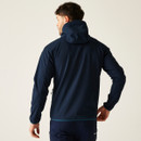 Rear lifestyle view of the jacket in action, displaying curved panel seams and comfortable shoulder fit.