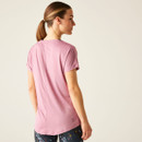 The back of a woman wearing a light pink t-shirt.